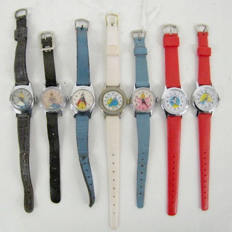 Group of 7 Vintage Disney Character Wrist Watches: 7 Vintage Disney Character Wrist Watches: Alice in Wonderland; 2 Snow White; Alice in pink flower; 2 Cinderella; Fairy Godmother (paint scrapes to dial). All on leather straps; none are new. Not teste