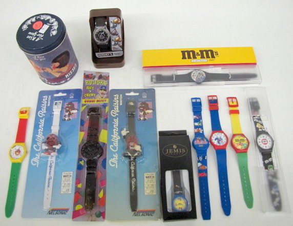 12 Food Advertising Wrist Watches & Other: 12 Food Advertising Wrist Watches & Other: 1.) 4 M&M Chocolate Candies: 1 multi-colored with yellow background; 1 red with party background; 1 white dial with red M in mailer; 1 blue saxophone player 