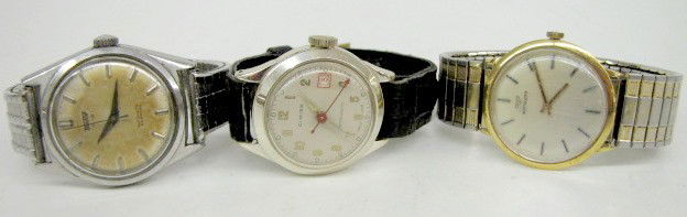 Group of 3 Men's Analog Wrist Watches: 3 Men's Analog Wrist Watches: 1.) Cimier with black strap. (Crystal is scratched.) 2.) Wittnauer with stretch band. (Crystal is scratched.) 3.) Tissot Automatic Seastar with metal stretch band. (Back