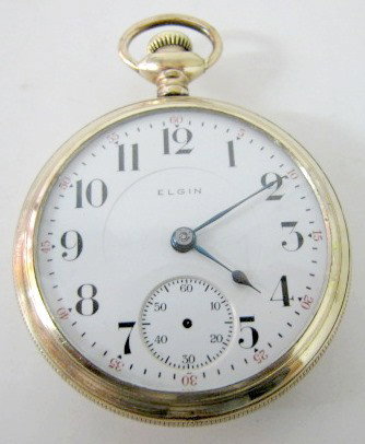 Elgin 17J 18S Open Face Pocket Watch: Elgin 17J 18S Open Face Pocket Watch: serial #18805147 in a 20 year Triumph case #414209; pendant set; balance is good. (Main spring doesn't engage; 2nds hands missing; case worn.) All items sell As I