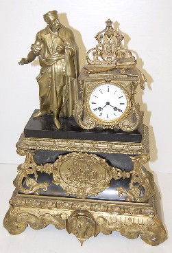 Signed Vincenti Bronze Statue Clock: Signed Vincenti Bronze Statue Clock: porcelain dial; time and strike; man in scholarly robes with books, tools and a G; base has a medallion of men on a raft and base bottom trim has a horse head; mov