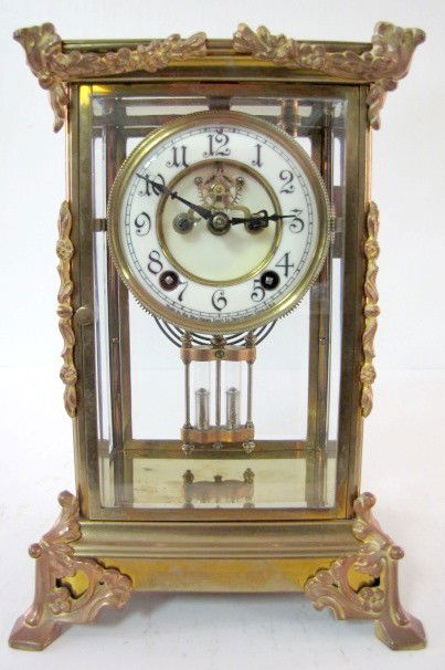 New Haven Torla Crystal Regulator Clock: New Haven Torla Crystal Regulator Clock: 8 day; time and strike; open escapement; porcelain dial; very ornate; brass and copper patina; circa 1900-1910. 11 3/4" All items sell As Is, Where Is, no guar