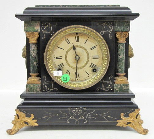 Seth Thomas Adamantine Mantle Clock: Seth Thomas Adamantine Mantle Clock: signed movement; time and strike; 8 day; black with green marbelized trim; paper dial; paper label on back; paper jeweler's repair label; lion heads on sides; has