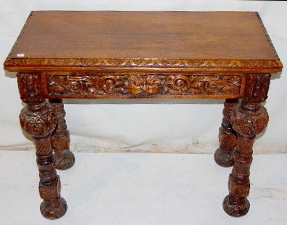 Antique Carved Oak Folding Top Card Table w/Face: - Ornate Antique Carved Oak Folding Top Card Table: with carved faces, legs, brass hardware with roller castors. (No felt) 31" x 36" x 18" *** Please note, this item is F.O.B. Marshalltown, IA, you mu