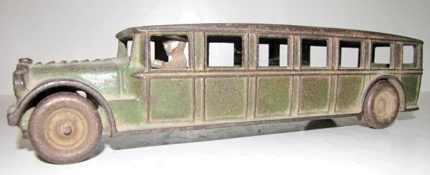 Cast Iron Arcade Touring Car w/Driver, 12 1/2": - Cast Iron Arcade Touring Car w/Driver: marked inside; metal wheels and driver; all original. (Paint worn.) 3" x 12 1/2" All items sell As Is, Where Is, no guarantees of any kind. We accept Mastercar