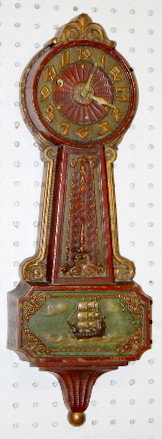 Miller Craftwood Colonial Banjo Clock: Miller Craftwood Colonial Banjo Clock: time only; keyhole between 9 and 10; partial label on back; brown, green and gold with molded ship scene. (Slight paint wear on edges.) 21" All items sell As Is,