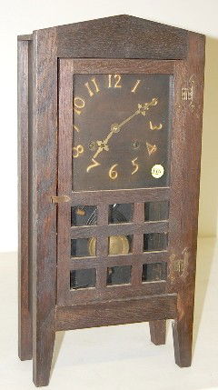 Mission Oak Shelf Clock: Mission Oak Shelf Clock: time and strike; metal numbers; has pendulum. (Door latch may have been changed; glass in door broken on bottom; some new screws and some missing screws around face; strike on