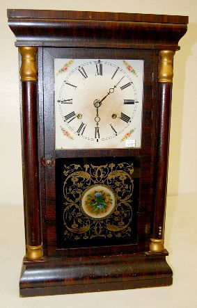 Seth Thomas Mahogany Half Splat Shelf Clock: Seth Thomas Mahogany Half Splat Shelf Clock: time and strike; has key, pendulum and weights; paper dial; bottom glass has blue floral center with gold leafy vine; good interior label; not tested for r