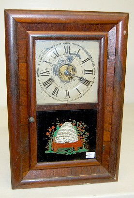 Seth Thomas 1/2 Size OG Clock: Seth Thomas 1/2 Size OG Clock: 8 day time, hour strike; 6 1/2" painted tin dial with Roman numerals; has pendulum; good interior label; beehive decorated lower door. (Dial crazed and chipped; pendulum
