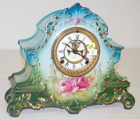 Ansonia "La Nord" China Mantle Clock: Ansonia "La Nord" China Mantle Clock: time and strike; 3 3/4" marked double sunk porcelain dial with visible escapement; hour and half hour strike; rose decorated green case; back marked Bonn Germany 