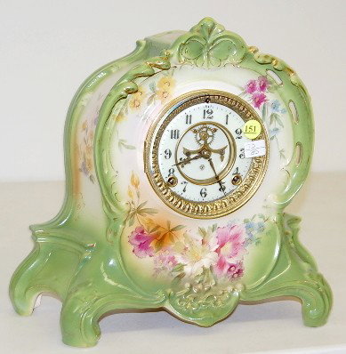 Ansonia "La Riviere" China Mantle Clock: Ansonia "La Riviere" China Mantle Clock: time and strike; 3 3/4" marked double sunk porcelain dial; visible escapement; floral decorated case; hour and half hour strike; back marked Bonn Germany La Ri