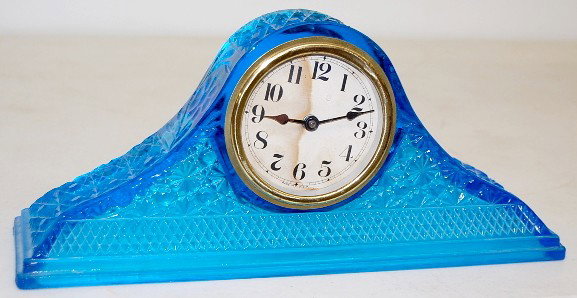 Blue Daisy & Button Pattern Glass Mantle Clock: Blue Daisy & Button Pattern Glass Mantle Clock: key wind; marked Made in U.S.A. paper dial. (Stained dial; clock slightly loose in case.) 6 1/4" x 14" and running at this time All items sell As Is, Wh