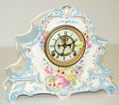 Ansonia "La Nord" China Mantle Clock: Ansonia "La Nord" China Mantle Clock: time and strike; 3 3/4" marked double sunk porcelain dial with visible escapement; hour and half hour strike; rose decorated cream and blue case; back marked Bonn