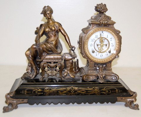 Antique Ansonia "Opera" Statue Clock: Antique Ansonia "Opera" Statue Clock: 8 day time and strike; 4 1/2" double sunk porcelain dial with Arabic numbers; has pendulum; signed movement; visible escapement; fancy hands. (Bottom sound board 