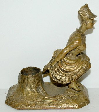 Naughty Brass Victorian Lady Figural Cigar Cutter: Brass Victorian Lady Figural Cigar Cutter: She appears to be squatting down by a tree stump, the cigar goes into her stomach area, press her head down to trim the cigar; unmarked. No condition problem