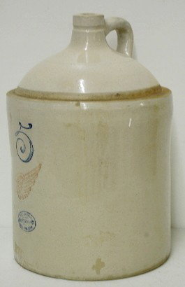 5 Gallon Red Wing Stoneware Jug: 5 Gallon Red Wing Stoneware Jug: Salt glaze cobalt 5 and Red Wing Union Stoneware Co. emblem, red wing. As made glaze flaws; chip on base and rim. 17" Tall. All items sell As Is, Where Is, no guarante