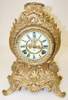Ansonia "Occident" Fancy Floral Clock : Ansonia "Occident" Fancy Floral Clock with porcelain dial, time and strike, open escapement; signed. 15 1/2" All items sell As Is, Where Is, no guarantees of any kind. We accept Mastercard & Visa, no 