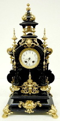 Lenzkirch Type Bronze Mounted Shelf Clock: Lenzkirch Type Bronze Mounted Shelf Clock: signed F.M.; wood and bronze; winged cherub; animal heads; ornate trim. 24 1/2" All items sell As Is, Where Is, no guarantees of any kind. We accept Masterca