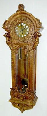 Large Gazo Zodiac Wall Hanging Regulator Clock: Large Gazo Zodiac Wall Hanging Regulator Clock: carved Alder wood case; w/nude figures; Zodiac winged angel head and foilage; engraved dial, 3 weights and pendulum; beveled glass; cartouche numerals.