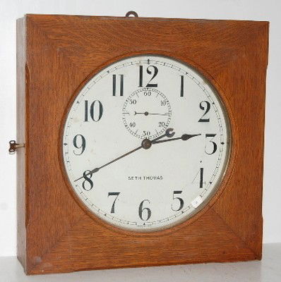 Oak Seth Thomas Gallery Clock: Oak Seth Thomas Gallery Clock: 13" dial; w/ seconds bit; brass pendulum. 19"sq. All items sell As Is, Where Is, no guarantees of any kind. We accept Mastercard & Visa, no paypal, no personal checks, n