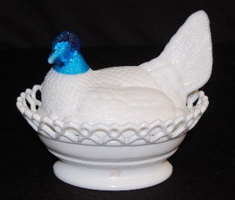 Blue Glass & White Milk Glass Hen on Nest: Blue Glass & White Milk Glass Hen on Nest: the hen's body and base are white milk glass, her head is clear blue glass. 8" L No Condition Problems. All items sell As Is, Where Is, no guarantees of any
