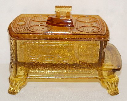 EAPG Amber Stone Butter Dish w/ Sad Iron: EAPG Amber Stone Butter Dish w/ Sad Iron: King Son & Co.; 1880's; the book doesn't show an amber one; the owner says this one is by LaBelle. Several scattered chips and nicks.) 5"T x 7 1/4" x 4 3/4" A