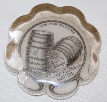 Glass Advertising Blake's Whiskey Paperweight: Glass Advertising Blake's Whiskey Paperweight: shown are two whiskey barrels with this on one end - G.O. Blake's Co. KY Bourbon Whiskey, marketed by Adams Taylor Co. Boston.; round. (Severe chip on th