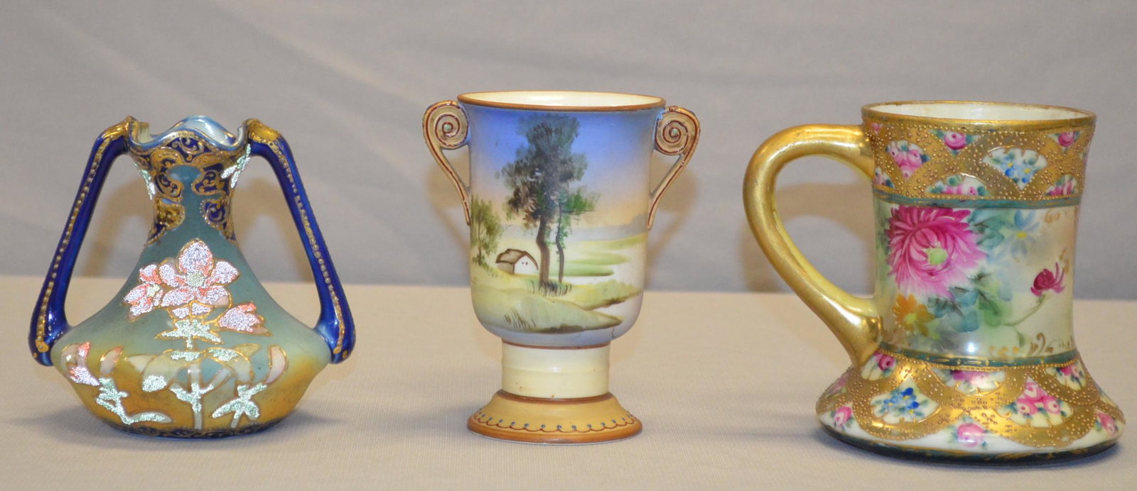 2 Nippon and 1 Japan Item: 2 Nippon and 1 Japan Item. 1) Squat vase with coralene floral motif. Rev mark U. S. Patnet- Feb 9, 1909, Japan in red. 4 /2"T. 2) Vase with country scene. Green wreath and M mark. 4 3/4"T. 3) Mug with