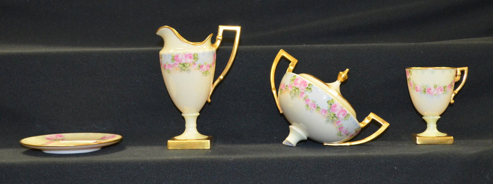 Lenox Belleek Stemmed Items: Lenox Belleek Stemmed Items. Floral dÃ©cor. Creamer 6"T. 2 cups 3 3/4"T. 2 cup plates 4 3/4"W. Covered sugar 5 3/4" stem glued.