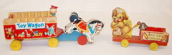 2 Vintage Fisher Price Wagon Pull Toys: 2 Fisher Price Wagon Pull Toys: 1.) Fisher Price #131 Toy Wagon, 1951. (Some edge wear & paper loss to one side.) 2.) #445 Hot Dog Wagon bell toy, 1940. (Edge wear; paper loss and staining.). Largest 