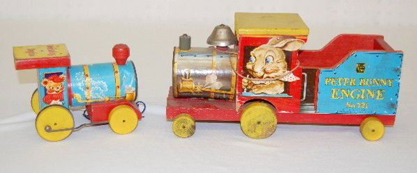 2 Fisher Price Train Engine Pull Toys: 2 Fisher Price Train Engine Pull Toys: 1.) #721 Peter Bunny Engine, Easter, 1949. (Paper loose with tears; edge loss.) 2.) #617 Whistling Engine w/Bear Engineer, 1957. (Edge wear; cardboard engine den