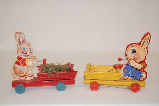2 Fisher Price Rabbit Pull Toys, Drummers: 2 Fisher Price Rabbit Pull Toys: 1.) #512 Bunny Drummer, Easter, 1942. Good condition. 2.) #508 Bunny Bell Drummer, Easter, 1949. (Minor visible wear but in overall good condition.) Largest 9 1/2" x 1