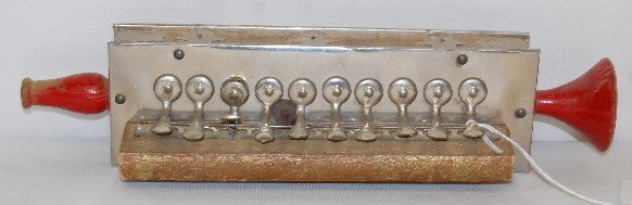 German Tin & Wood Toy Instrument: German Tin & Wood Toy Instrument: marked Germany, does play when blown into. 12 1/2"L In as is, as found, used condition. All items sell As Is, Where Is, no guarantees of any kind. We accept Mastercar