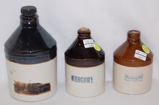 3 Mercury Stoneware Bottles: 3 Mercury Stoneware Bottles: all have partial or full labels on back; brown & white glaze. Tallest is 6"T All items sell As Is, Where Is, no guarantees of any kind. We accept Mastercard & Visa, no pay