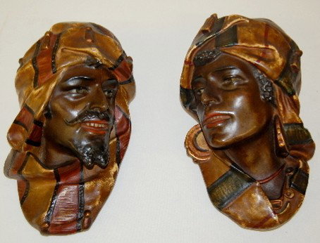 Pair Hanging Busts, Arabian Man & Woman: Pair Hanging Busts, Arabian Man & Woman: made of hard plaster; with realistic painted decoration; no maker information; circa early to mid 20th century. 12" Long. No Condition Problems. All items sell