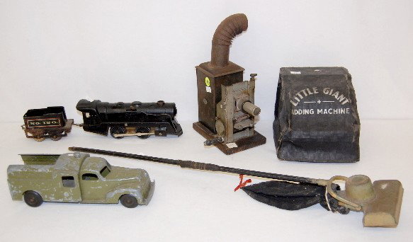Little Giant Adding Machine & Toys: Little Giant Adding Machine & Toys: the machine is a Little Giant; there is a toy vacuum, truck, train and magic lantern. No Condition Problems. All items sell As Is, Where Is, no guarantees of any ki