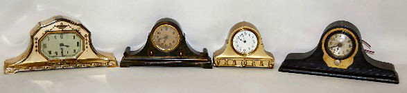 New Haven, Lux and U.S.A. Metal Mantel Clocks: New Haven, Lux and U.S.A. Metal Mantel Clocks: 1.) Lux, marked textured paper dial; Grecian urn decorated case; TO. (Not running.) 2.) Lux, marked paper dial; Benedict Karnack Brass 832 scarab decorat