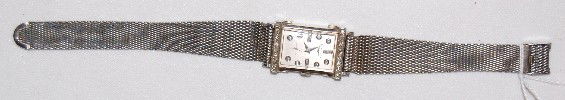 Longines 9LT, 14K, Diamond, 17J, Wrist Watch: Longines 9LT, 14K, Diamond, 17J, Wrist Watch: S.N. 9683615; the silver dial has silver hands and diamond markers. The white gold case is marked inside Longines-Wittnauer Watch Co. Inc., New York - Gen