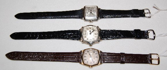 3 Men's Illinois Wrist Watches: Jolly Roger +: 3 Men's Illinois Wrist Watches: Jolly Roger +: Illinois 17J, Jolly Roger No. 5265493; DMK movement with a silver dial and engraved bezel; in a white 14K gold filled J. Boss, Model 176 case No. 25208; 