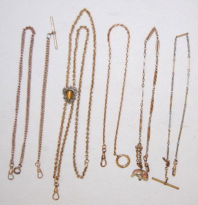 6 Watch Chains, 1 with Sterling Slide: 6 Watch Chains, 1 with Sterling Slide: another has a small soapstone elephant fob; several link styles included; all have useable ends and are lengths of 6 3/4" to 15 1/2"; the sterling slide has a ca