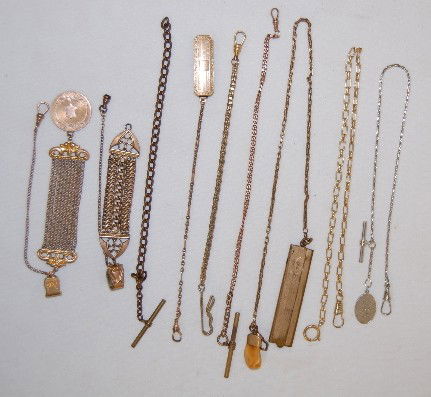 9 Watch Chains, One with Comb and Elk Lodge Seal: 9 Watch Chains, One with Comb and Elk Lodge Seal: The Elk Lodge souvenir is mounted in a marked 14K setting, on the other end is a 2 piece moustache comb; seven chains are safety style chains; 2 look