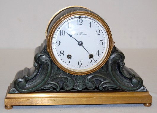 Seth Thomas "Tampa" Metal Case Mantel Clock: Seth Thomas "Tampa" Metal Case Mantel Clock: has pendulum and key; Seth Thomas marked porcelain dial; 7 day; half hour strike; Verde top and body with gold base; S.T. marked brass movement; convex gla