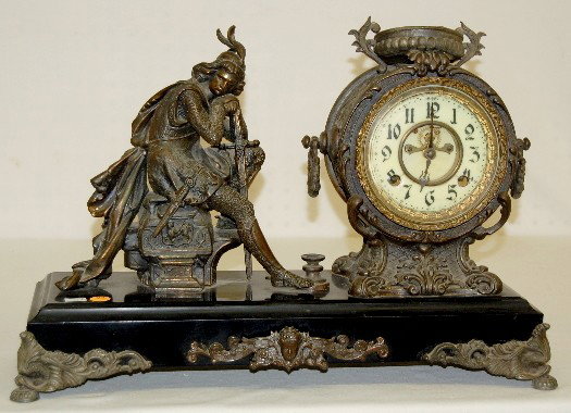 New Haven "Ivanhoe" Statue Clock : New Haven "Ivanhoe" Statue Clock: 8 day, half hour gong strike; porcelain dial with visible movement; seated warrior with feathered cap, sword and dagger; unmarked brass movement. (No pendulum or key;
