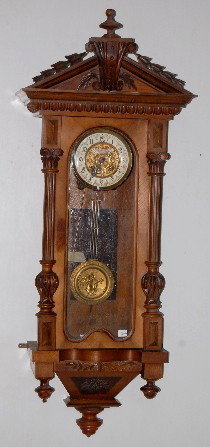 Gustav Becker RA, Dial Signed Budapest: Gustav Becker RA; 397330; dial signed Budapest; decorated porcelain chapter ring with embossed center; embossed musical couple pendulum; nicely carved case. (Part of gong is detached; wormholes.) Not 