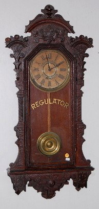 Ingraham Oak "Pacific" Advertising Clock: Ingraham Oak "Pacific" Advertising Clock: has pendulum and key; paper dial advertising "Chas. Hanson City Jewelers"; gilt "Regulator" on door. (Dial darkened.) Not tested. 37" All Items Sell As Is, Wh