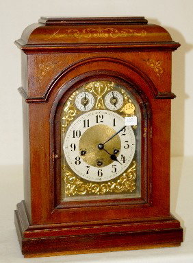 Junghans Westminster Chime Mantel Clock: Junghans Westminster Chime Mantel Clock: has pendulum and key; 3 key holes; unmarked gold metal dial with fancy filigree decoration, chime and speed dials. Brass movement marked Junghans A09; 4 bar st