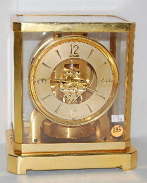 Le Coultre Atmos 15 Jewel Shelf Clock: Le Coultre Atmos 15 Jewel Shelf Clock: gold metal dial marked Le Coultre; center marked Le Coultre, Switzerland, Atmos, Fifteen 15 VXN Jewels; marked on top of works No. 59695; base also marked. (Very
