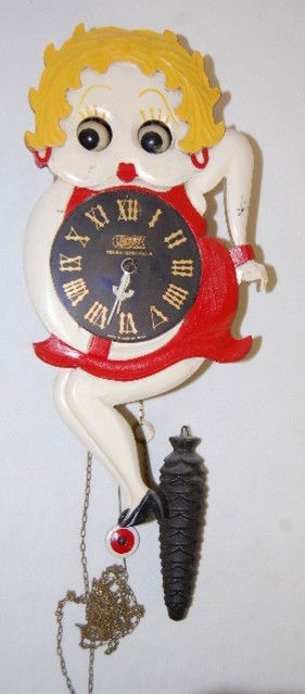 Tezuka Clock Co. Betty Boop Animated Clock: Tezuka Clock Co. Betty Boop Animated Clock: marked Poppo Tezuka Clock Co.; Made in Occupied Japan; all wood with moving eyes; has pendulum and pinecone weight. Not tested. 13 3/4" All Items Sell As Is