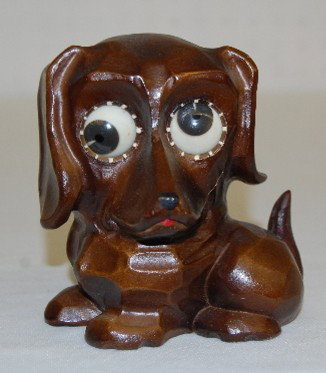 Oswald Googlie Eye Dog Clock: Oswald Googlie Eye Dog Clock: animated eye dials; carved Dachsund style case; paper S label on the bottom; fixed key wind movement. Not working. 4 5/8" All Items Sell As Is, Where Is, No Guarantees of