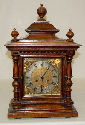 Muller & Co. Germany Mantel Clock: Muller & Co. Germany Mantel Clock: gold metal dial with lady head cartouche corners; has pendulum; T & 2 gong strike; movement marked with a rose and RSM 10542 2; beveled glass. (Wound tight; dial scr